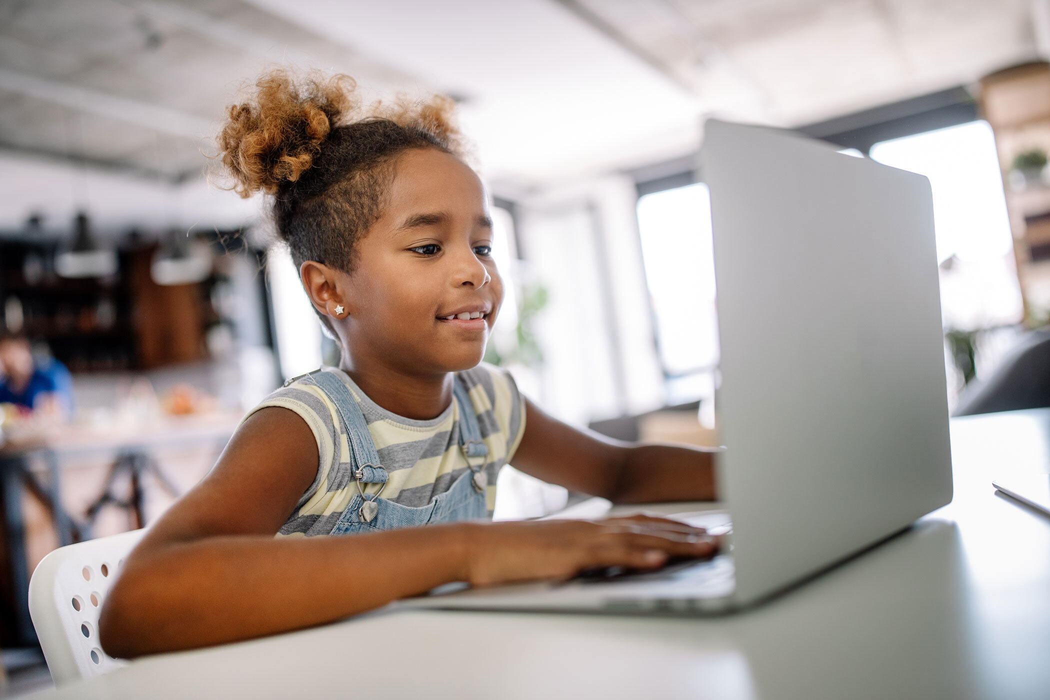 Young student studying with a laptop